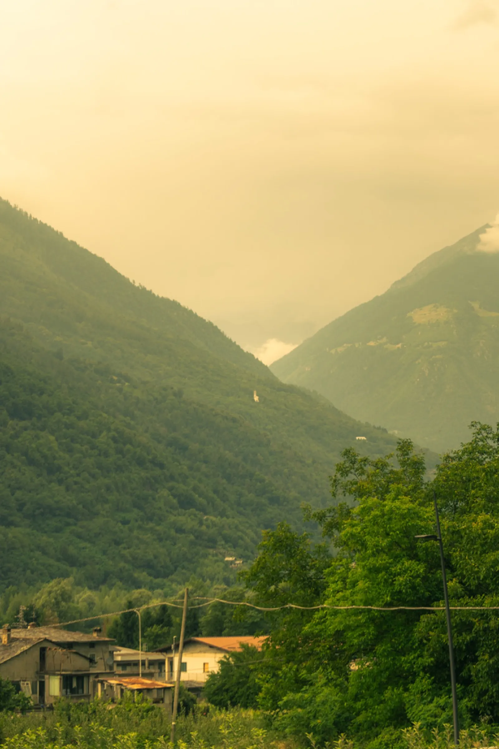Narrow valley between steep mountains with village