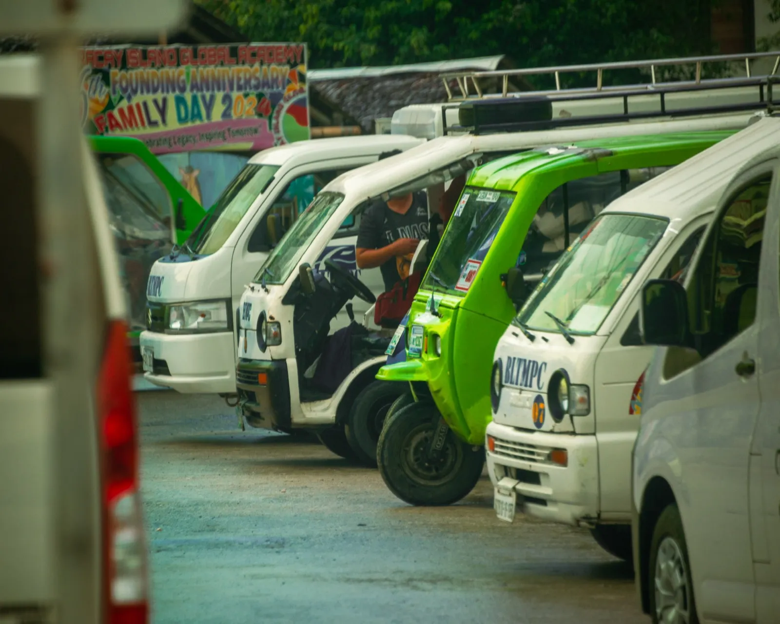Colourful jeepneys lined up at community event