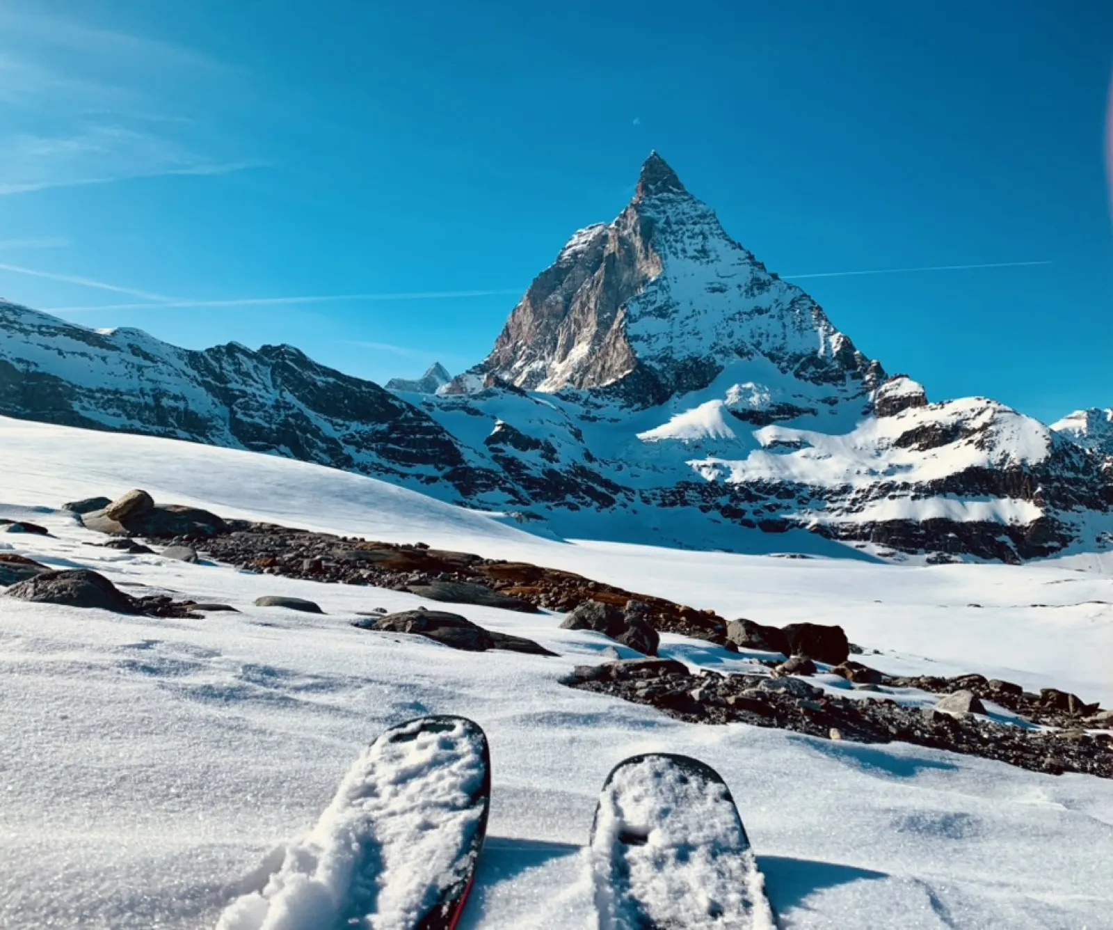 Skier gazing at iconic Matterhorn pyramid